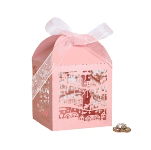 Pink laser-cut architectural gift box with THANK YOU lettering and white ribbon bow