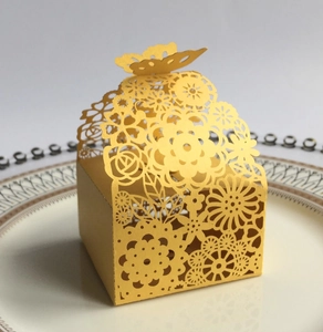 Laser-cut yellow gift box with floral patterns and a butterfly top for weddings