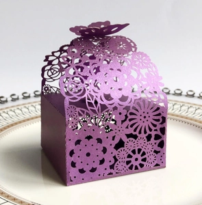 Elegant purple laser cut favor box with butterfly top and floral hollow patterns