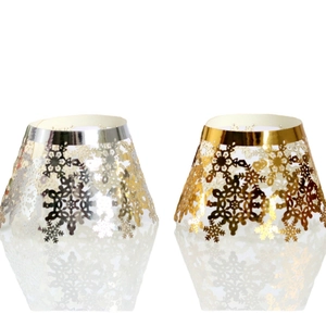 Golden and silver laser-cut cupcake wrappers with snowflake patterns for Christmas