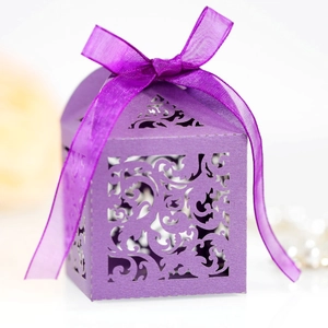 Elegant purple hollow-out wedding favor box with silk ribbon and laser-cut design