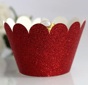 Sparkling red glitter cupcake wrapper with scalloped edges for festive party decorations