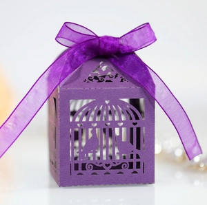 Detailed laser cut dark purple wedding favor box featuring birds and heart patterns