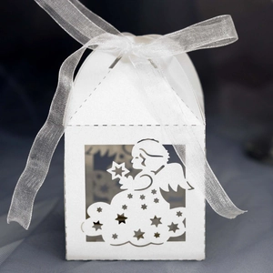 Detailed laser-cut white angel favor box with organza ribbon for baptism parties