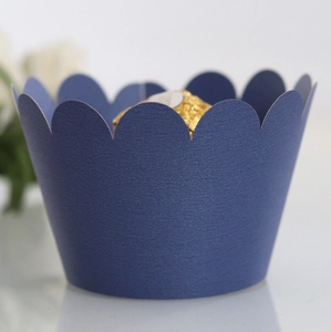 Dark blue wavy cupcake wrapper with horizontal texture and gold chocolate accent
