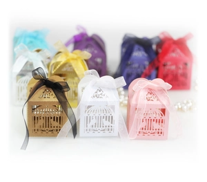 Laser-cut birdcage wedding favor boxes with birds design and ribbon bows in various colors