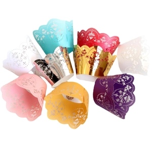 Laser cut hollow floral cupcake wrappers in multiple vibrant colors for wedding decor