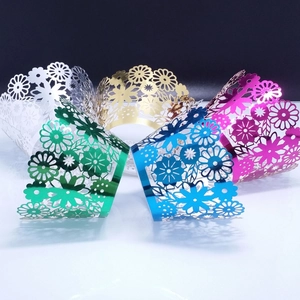 Metallic hollow floral cupcake wrappers in gold silver blue green and pink finishes