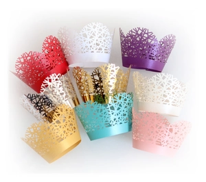 Laser cut hollow tree branch cupcake wrappers in multiple vibrant metallic colors