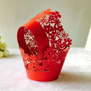 Laser cut red floral paper cupcake wrappers for elegant party dessert decorations