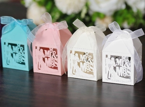 Laser-cut wedding favor boxes with Mr & Mrs silhouette and elegant organza ribbon bows