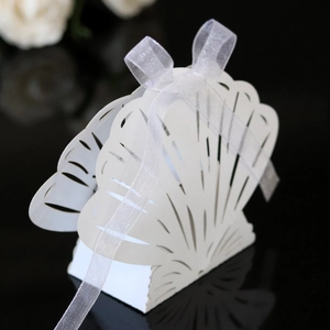 Laser cut shell shaped wedding candy box with cream white cardstock and sheer ribbon bow