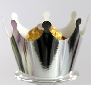Silver mirror crown cupcake wrapper with metallic finish showing a chocolate ball