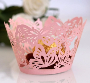 Detailed laser-cut pink butterfly cupcake wrapper with floral pattern for weddings