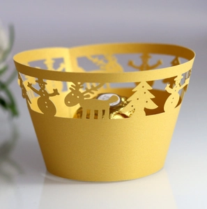 Golden Christmas cupcake wrapper with laser-cut reindeer and snowman paper design