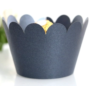 Detail of dark grey pearl cupcake wrapper with scalloped edges for elegant desserts