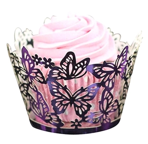 Detail of laser-cut dark purple butterfly lace cupcake wrapper around a pink cupcake