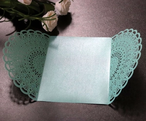 Elegant laser-cut hollow blue invitation cover with pearlescent finish for weddings