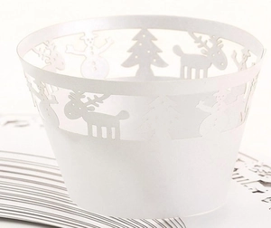 Detailed laser cut white Christmas cupcake wrapper featuring reindeer and tree patterns