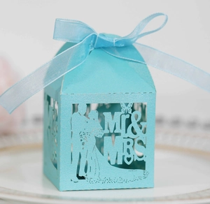 Close-up of laser-cut Tiffany blue Mr & Mrs wedding candy box with a ribbon bow