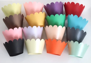Close-up of wavy gold reflective cupcake liners in 16 assorted metallic colors