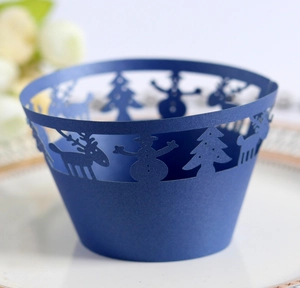 Detailed laser-cut blue Christmas cupcake wrapper with reindeer and snowflake patterns