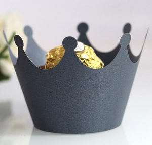 Detailed macro view of dark grey pearlescent paper crown laser cut cupcake wrappers