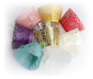 Laser cut hollow wedding cupcake liners with floral leaf patterns in multiple colors