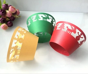 Laser cut Christmas cupcake wrappers featuring reindeer and snowmen in red, green and gold