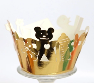Golden laser-cut cupcake wrappers with cute bear patterns for baby shower parties