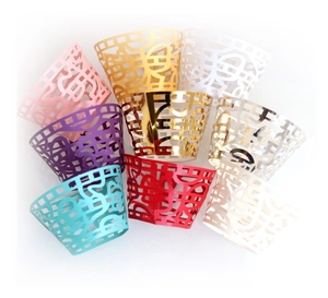 Laser cut cupcake wrappers in multiple pearlescent colors with geometric hollow design