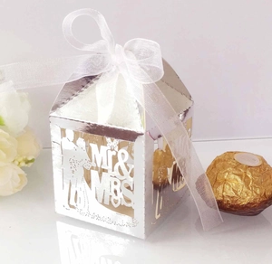 Detailed laser-cut silver candy box with Mr & Mrs design and elegant white ribbon