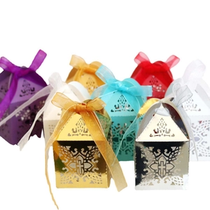 Laser-cut wedding favor gift boxes with cross patterns and satin ribbon bow ties