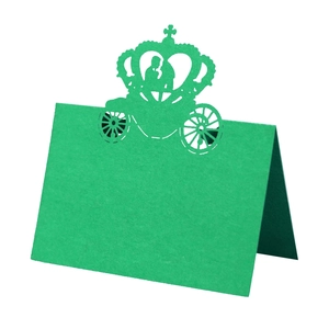 Emerald green hollow laser-cut wedding table card with a royal carriage and crown design