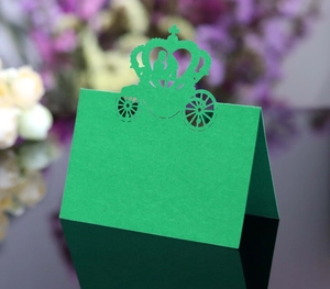 Detailed laser-cut hollow crown and carriage place card in elegant bright green color
