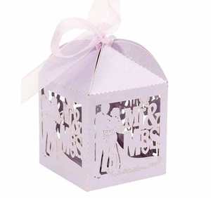 Close-up of laser-cut Mr & Mrs lavender wedding candy box with elegant purple ribbon