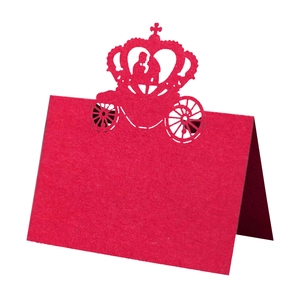 Detailed laser-cut red wedding place card with intricate carriage and crown silhouette