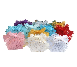 Laser cut hollow floral wedding favor boxes with organza ribbons in multiple colors