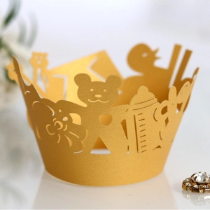 Golden pearlescent hollow cupcake wrappers with laser cut bears and milk bottles