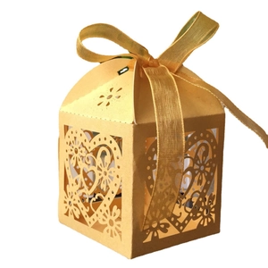 Golden laser-cut heart candy box with silk ribbon bow for weddings and parties