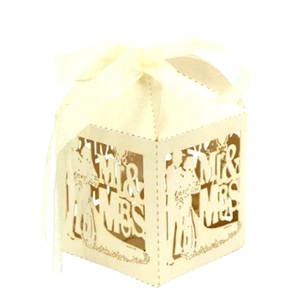 Detail of laser-cut Mr & Mrs wedding candy box with gold liner and white ribbon