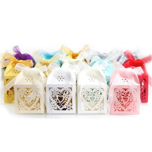 Laser-cut heart favor boxes in multiple colors with silk ribbons for wedding parties