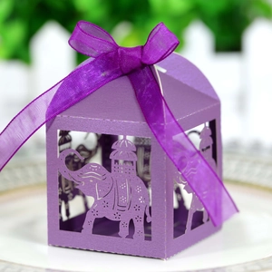 Detailed laser-cut elephant pattern on a purple hollow candy gift box with a silk ribbon