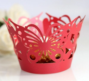 Laser-cut red butterfly cupcake wrapper in pearlescent paper for wedding party decor