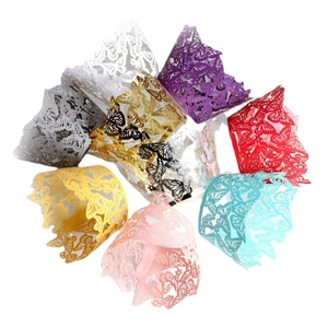 Laser-cut butterfly cupcake wrappers in various pearlescent colors with wavy edges