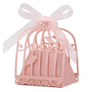 Pink laser-cut birdcage wedding candy box with pearlescent finish and silk ribbon