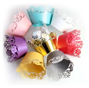 Laser-cut ocean themed fish cupcake wrappers in various metallic pearl paper colors