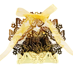 Golden laser-cut butterfly candy box with a yellow chiffon ribbon for weddings