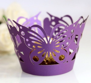 Deep purple laser-cut cupcake wrapper with elegant butterfly lace pattern and gold chocolate