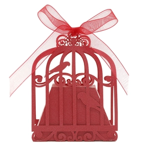 Detailed laser-cut birdcage wedding candy box in vibrant red with elegant silk ribbon